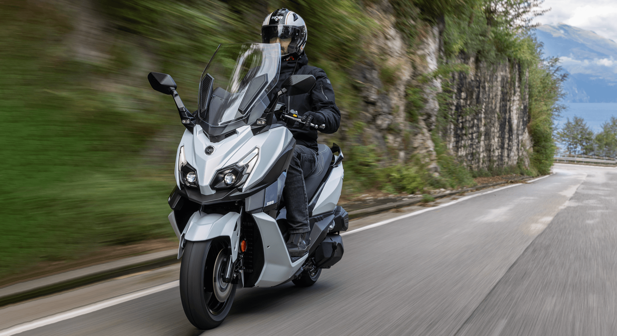 SYM CRUiSYM scooter riding on a mountain road