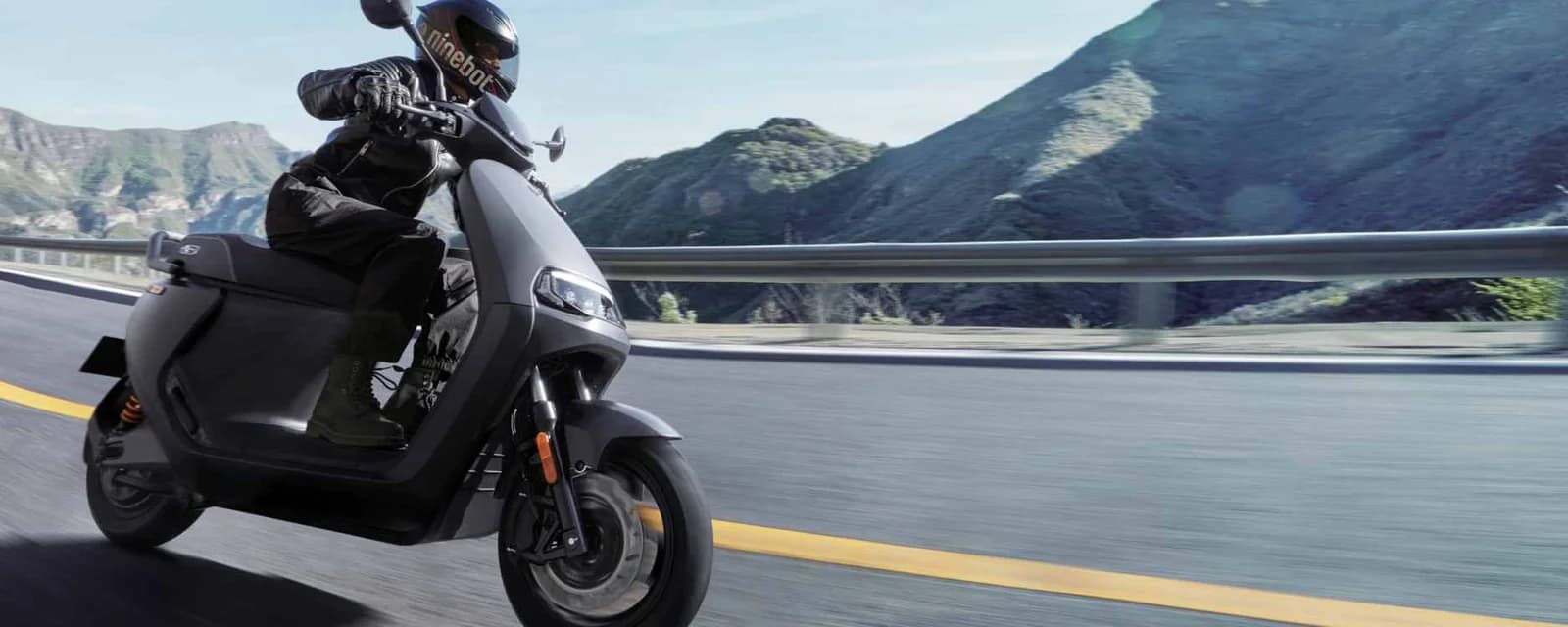 Segway E300SE electric scooter riding on a mountain road