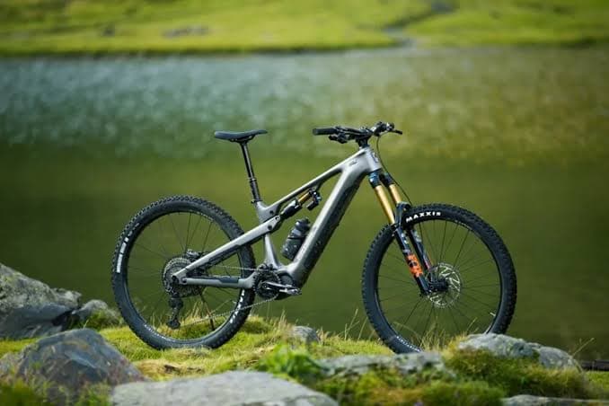 Patrol full-suspension mountain bike beside an alpine lake