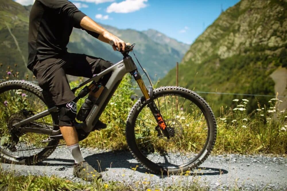 Rider on a Patrol electric mountain bike in the mountains